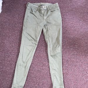 Next level stretch arm green skinny jeans